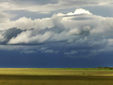 Storm Clouds Building over the Mara Savannah at Dusk Photographic Print by Doug McKinlay