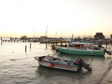 Boats at Sunset from Pier at Picus Cockteleria Photographie par Dennis Johnson