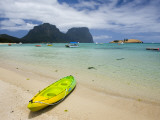 Canoe on Lagoon Beach with Mount Lidgford and Mount Gower in Background Photographic Print by Christopher Groenhout