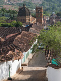 Cobblestone Street with Colonial Houses and Catedral De La Inmaculada Concepcion in Background Photographic Print by Margie Politzer