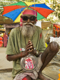 Portrait of Sadhu Wannabe, One of Many Fake Holy Men Looking for Donations During Pushkar Mela. Photographic Print by Dan Gair