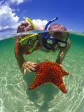 Two People Snorkelling with Starfish Photographic Print by Greg Johnston