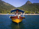 Man on Moored Boat Off Ilha Grande Shore Photographie par Micah Wright