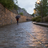 Pedestrian on Cobblestoned Street Photographic Print by Denis Corriveau