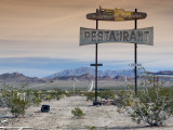 Old Restaurant Sign at Route 66 Near Chambless with Marble Mountains in Distance Photographic Print by Witold Skrypczak