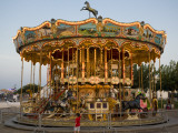 Merry-Go-Round at Saintes-Maries-De-La-Mer Photographic Print by Manfred Gottschalk