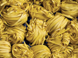 Clusters of Yellow Egg Noodles at Street Side Stall Photographic Print by Antony Giblin
