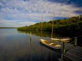 Traditional Florida Shallow Draft Boats Moored at Cock's Footbridge, Spanish Point Photographic Print by Michael Lawrence
