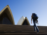 Backpacker Climbing Steps of Sydney Opera House Photographic Print by Andrew Watson
