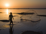 Fisherman Casting Net in the Niger River at Segoukoro Photographic Print by Matthew Schoenfelder