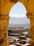 Archway of Old Tomb with City in Background Fotografie-Druck von Stephane Victor