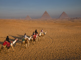 Tourists on Camels and Pyramids of Giza Photographic Print by Richard l'Anson