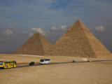 Tour Buses and Cars Driving by Pyramids of Giza Photographic Print by Richard l'Anson