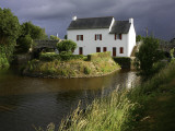 Stormy Sky Behind Lock Keeper's Cottage on Canal De Languitre at Rose Photographic Print by Barbara Van Zanten