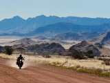 Motorbike Riding Through the Tarisberg Range Photographic Print by Todd Lawson