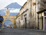 Volcan De Agua Looming Behind Santa Catalina Arch Photographic Print by Sean Caffrey