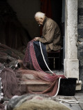 Fisherman Repairing Net Photographic Print by Will Salter