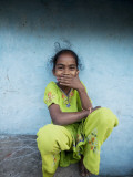 Litle Girl Self-Consciously Covering Her Mouth as She Smiles Photographic Print by April Maciborka