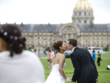 Wedding Couple Kissing with Les Invalides in Background Photographic Print by Lou Jones