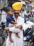 Rajasthani Man and His Son Waiting for Chai Near Local Motorcycle Shop Photographic Print by April Maciborka