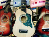 Guitars for Sale at the New Mexico State Fair Photographic Print by Ray Laskowitz