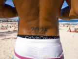 Man with Bondi Post Code Tattooed on His Back Standing on Bondi Beach Photographic Print by Oliver Strewe