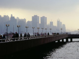 People on the Esplanade, and a View of Hong Kong Island Shrouded in a Twilight Mis Photographic Print by Richard l'Anson