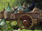 Discarded Wine Demijohns in Cart at Villa a Sesta Photographic Print by Rocco Fasano