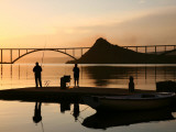 Couple Fishing from Stone Pier with Krk Bridge Joining Krk Island to Mainland Photographic Print by Ruth Eastham & Max Paoli