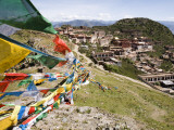 Colourful Prayer Flags at Ganden Monastery Photographic Print by Tim Hughes