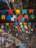 Interior of Ceprama Building with Colourful Flags Celebrating St John's Festivial. Photographic Print by Viviane Ponti