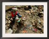 A Lebanese Woman Try to Salvage Some Belongings Amongst the Rubble of Their House Framed Photographic Print