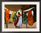 A Sudanese Woman Buys a Dress for Her Daughter at the Zamzam Refugee Camp Framed Photographic Print by Nasser Nasser