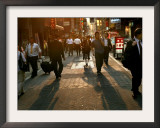 Japanese Commuters Walk Through a Tokyo Street on Their Way to the Train Stations Framed Photographic Print by David Guttenfelder