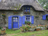 Thatched Cottage with Blue Doors, Windows and Pots of Geraniums Near Marzan Photographie par Barbara Van Zanten