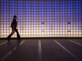 Pedestrian in a Neon-Lit Passageway in Namba Station Photographic Print by Brent Winebrenner