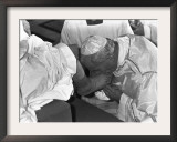 Pope John Paul II Kisses the Feet of One of 12 Mentally Retarded Italians Framed Photographic Print