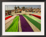 Clothes of Hindu Devotee are Laid out to Dry after Being Drenched During Ritualistic Holy Dips Framed Photographic Print by Aman Sharma