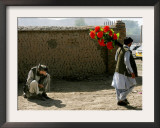 A Man Ignores a Passing Photographer Who Continues His Way Looking for Clients Framed Photographic Print