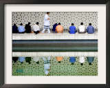 With the Water Reflection, a Muslim Man Walks Past Others Offering the Friday Prayer at a Mosque Framed Photographic Print