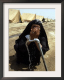 A Woman Washes Her Face with Water from a Tap at a Camp for Displaced Iraqis Framed Photographic Print