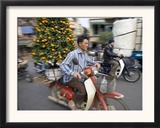 A Vietnamese Vendor Races Down a Street on a Motorbike Carrying a Kumquat Tree for Sale Framed Photographic Print