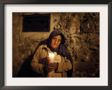 Elderly Woman Holds a Candle as She Takes Part in a Procession During Holy Week in Taxco, Mexico Framed Photographic Print