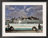 Palestinians Sit on Top of a Bus Framed Photographic Print
