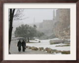 Two Priests Walk in Snow in Front of the Jaffa Gate in Jerusalem's Old City, December 27, 2006 Framed Photographic Print by Oded Balilty