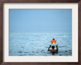A Devotee Immerses the Idol of Elephant-Headed Hindu God Ganesh Framed Photographic Print