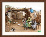 A Sudanese Family is Seen Inside Their Thatched Hut During the Visit of Unicef Goodwill Ambassador Framed Photographic Print