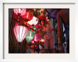 A Lantern Vendor Displays Her Silk Lanterns to a Tourist During the Full Moon Festival Framed Photographic Print