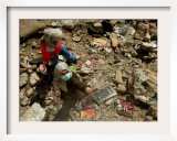 A Lebanese Woman Try to Salvage Some Belongings Amongst the Rubble of Their House Framed Photographic Print
