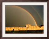 An Afghan Girl Walks Past Destroyed Buildings Occupied by Refugees Framed Photographic Print